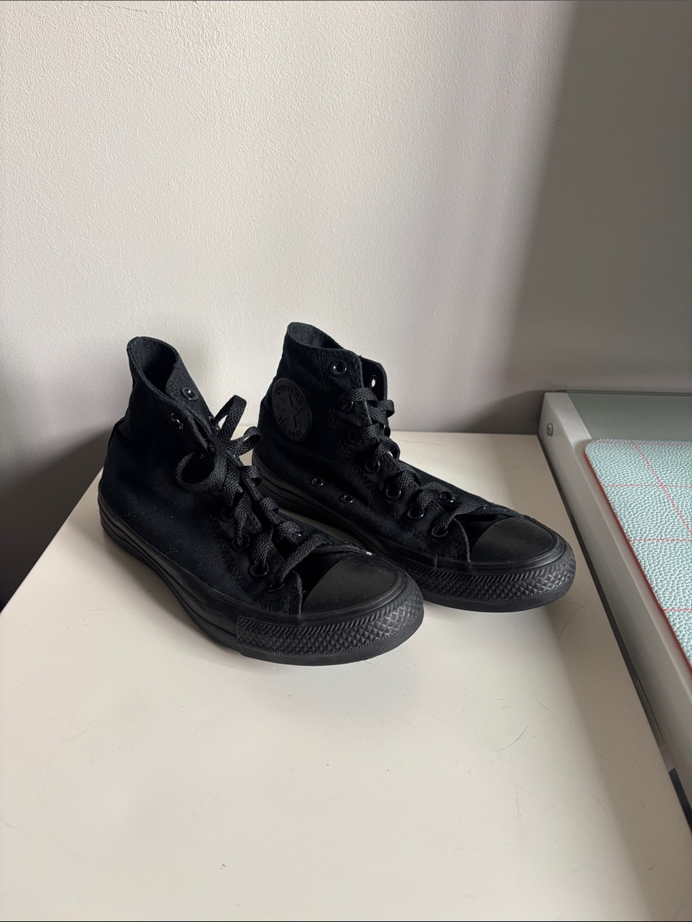 Black High-Top Converse shoes